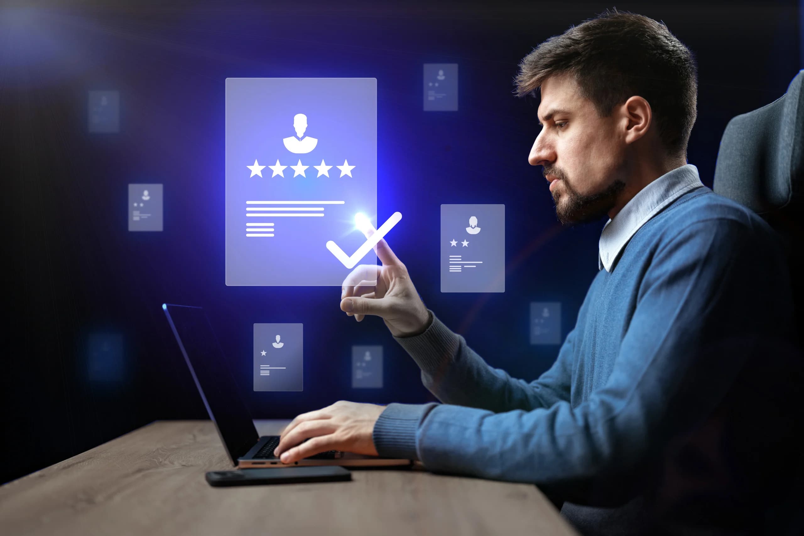 man-interacting-with-digital-interface-while-reviewing-customer-feedback-laptop-modern