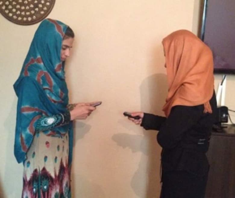 Hafasa-Aubi-doing-a-mobile-money-transaction